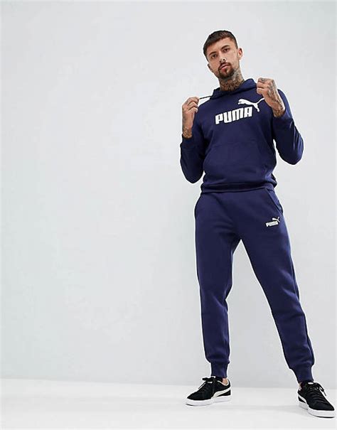 tuta blu navy con striscie laterali bianche|Tuta Puma Essentials blu navy nero .